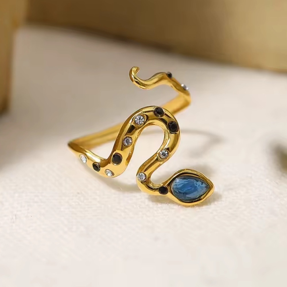 Serpenti Elegant Gold Snake Ring with Blue Accents